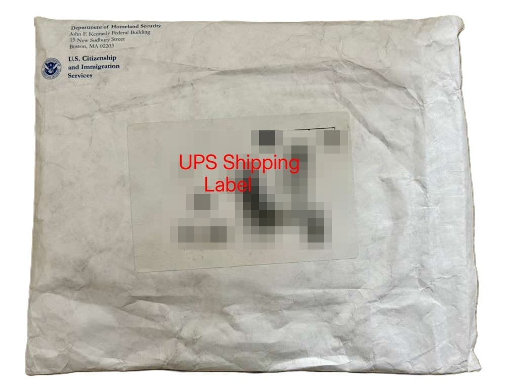 Redacted USCIS package with UPS shipping label